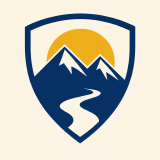 A pixelated mountain crest badge, shown enlarged to show the pixels.